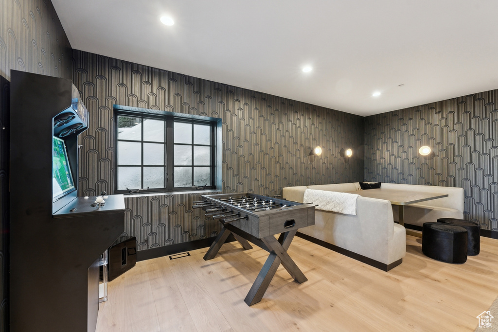 Playroom featuring light wood-style floors, recessed lighting, and wallpapered walls