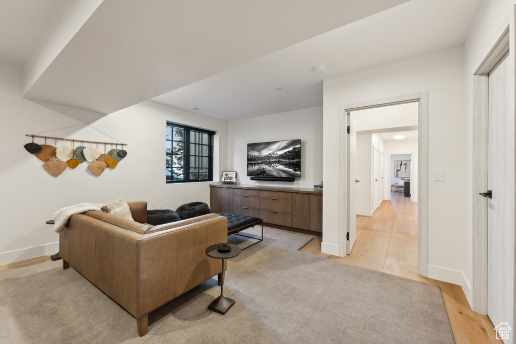 Living room with light wood finished floors and baseboards