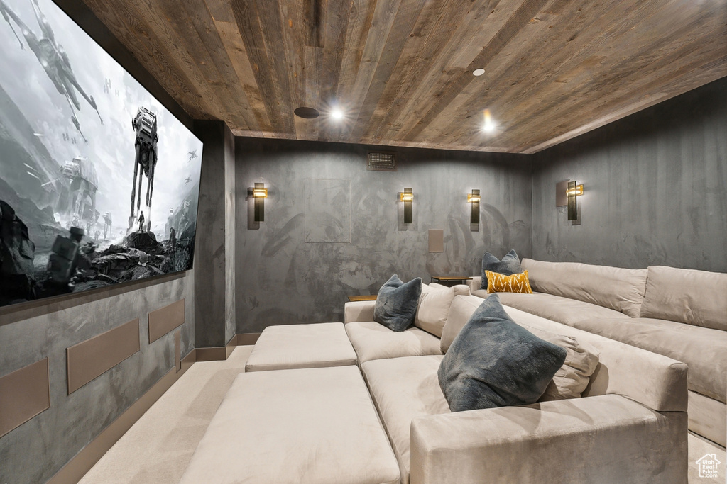 Home theater room featuring wood ceiling and recessed lighting
