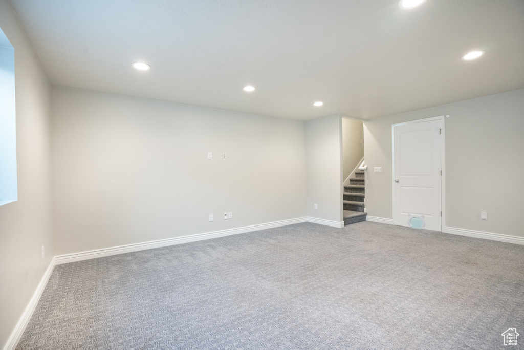 Finished basement featuring stairway, carpet, recessed lighting, and baseboards