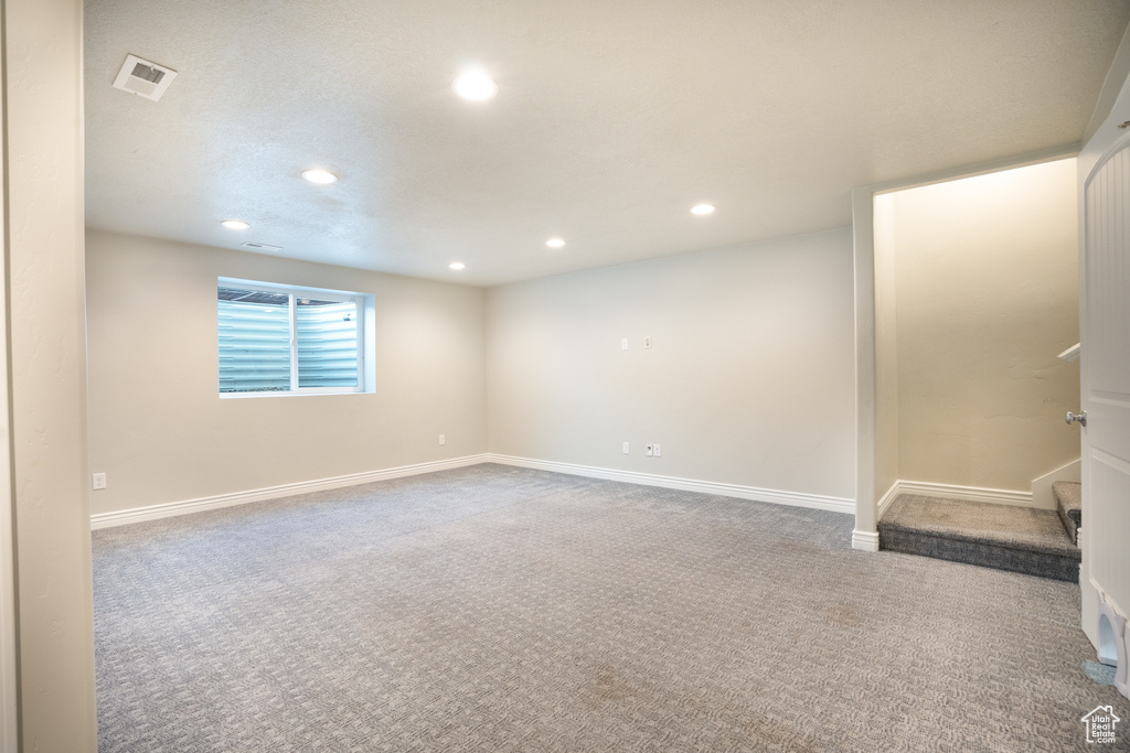 Basement with recessed lighting, carpet flooring, and baseboards