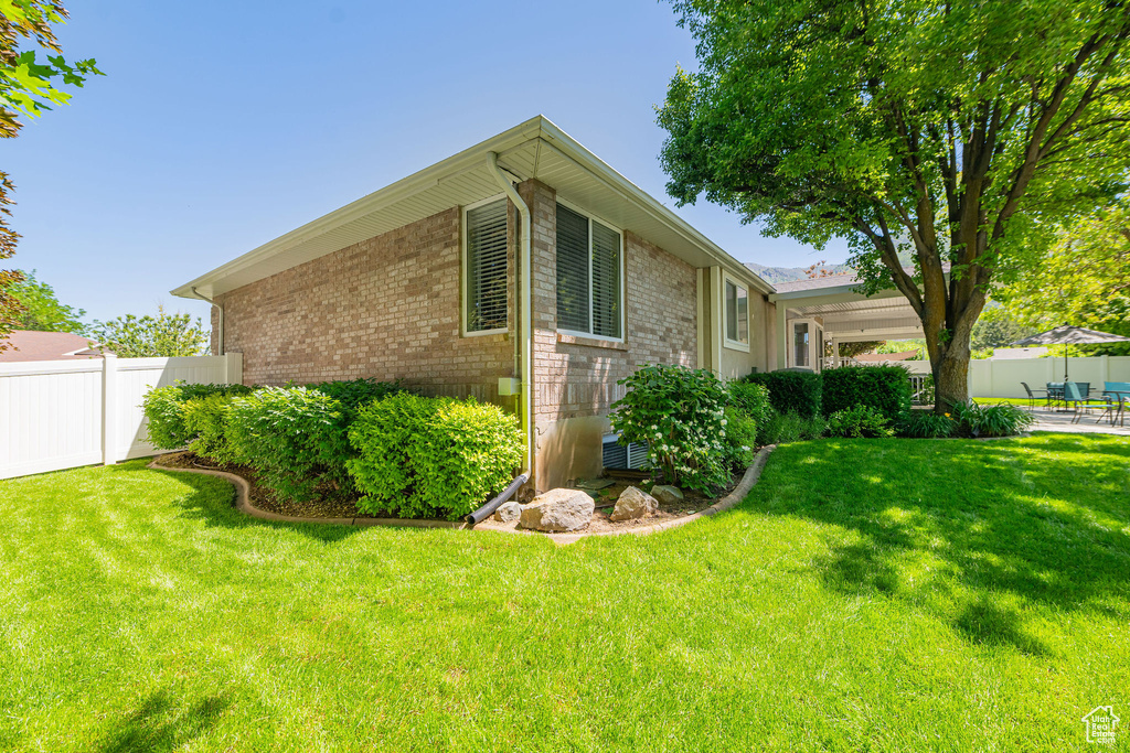 View of home\\\\\\\\\\\\\\\'s exterior with brick siding and a patio area