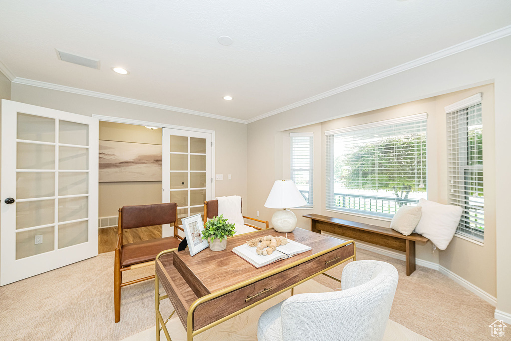 Home office with french doors, light carpet, crown molding, baseboards, and recessed lighting