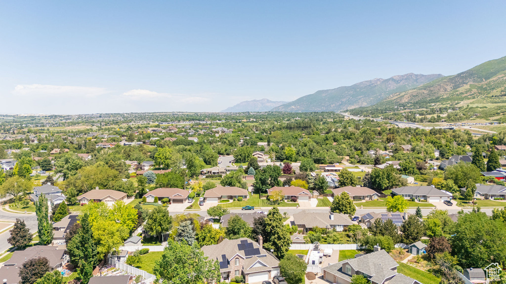 Aerial view of residential area featuring mountains