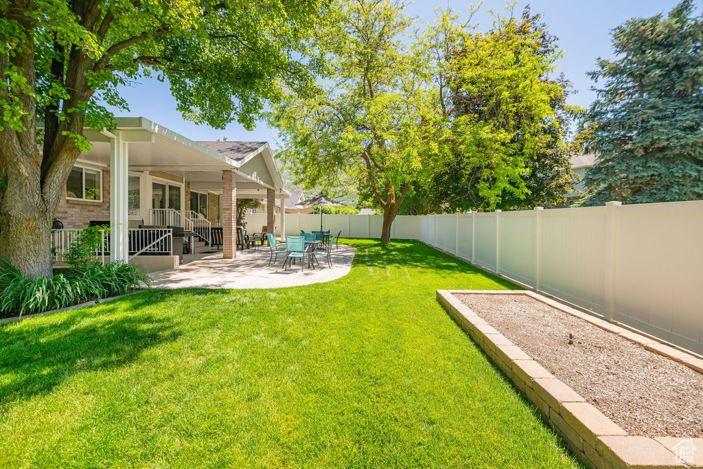 View of yard with a patio area