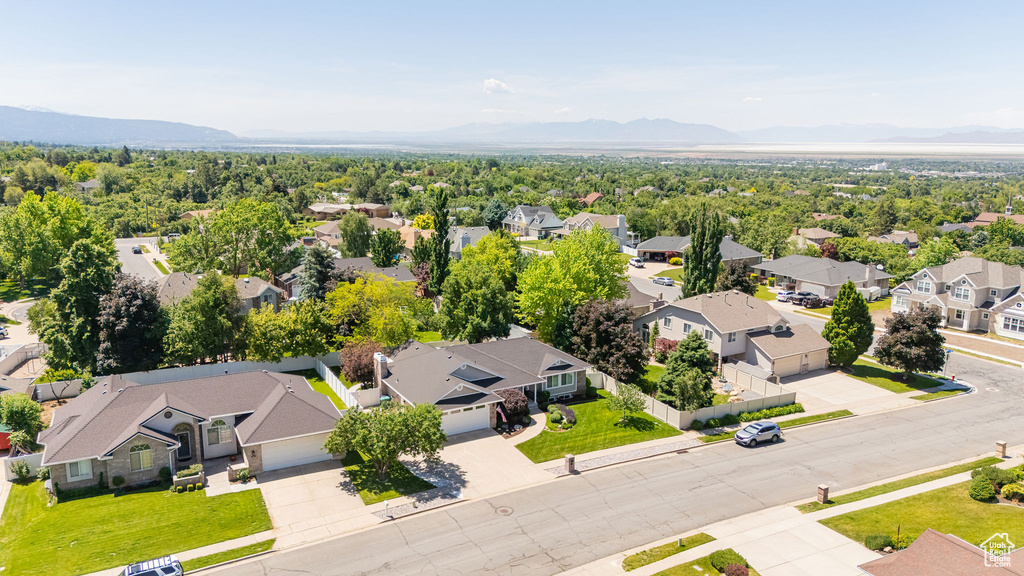 Aerial view of residential area featuring a mountainous background