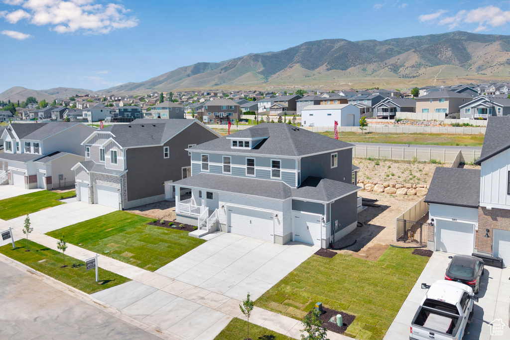 Aerial perspective of suburban area featuring a mountain backdrop