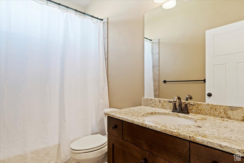 Full bath with vanity and toilet
