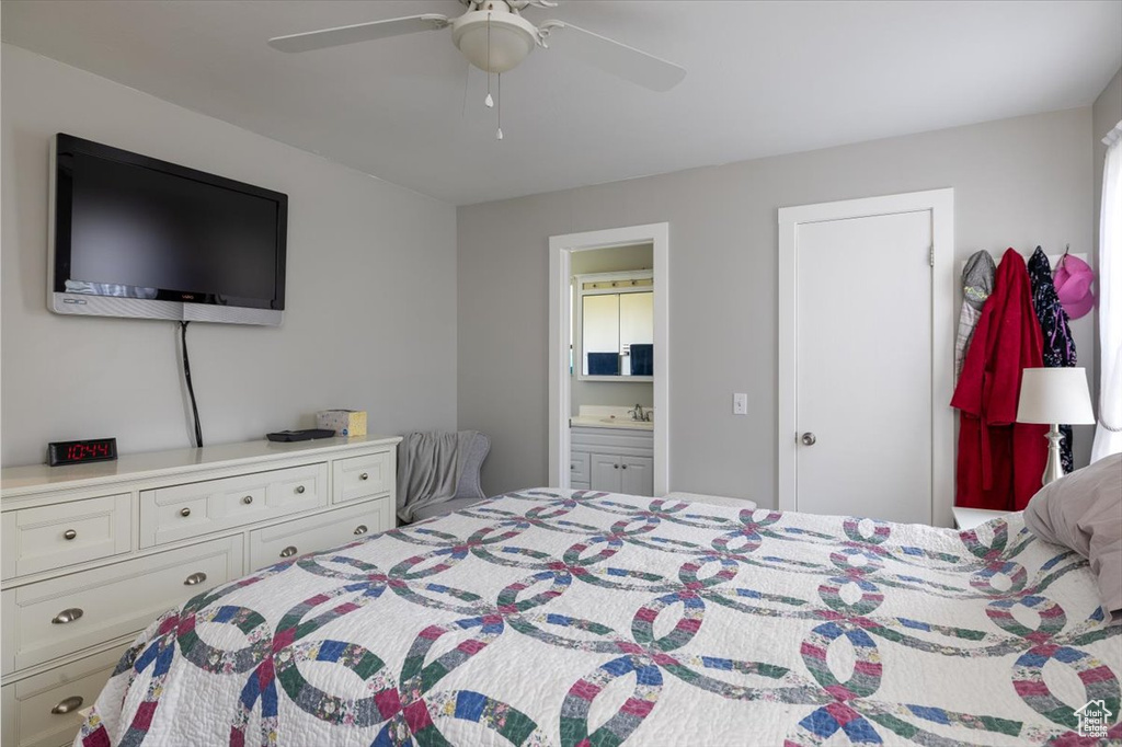 Bedroom with ensuite bathroom and ceiling fan