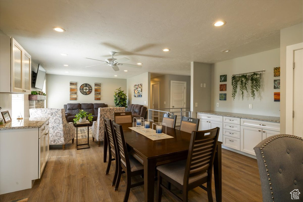 Dining space with recessed lighting, dark wood-type flooring, and ceiling fan