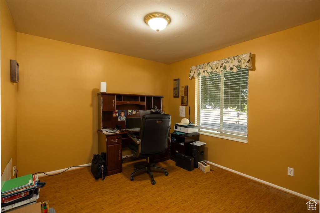 Home office featuring baseboards