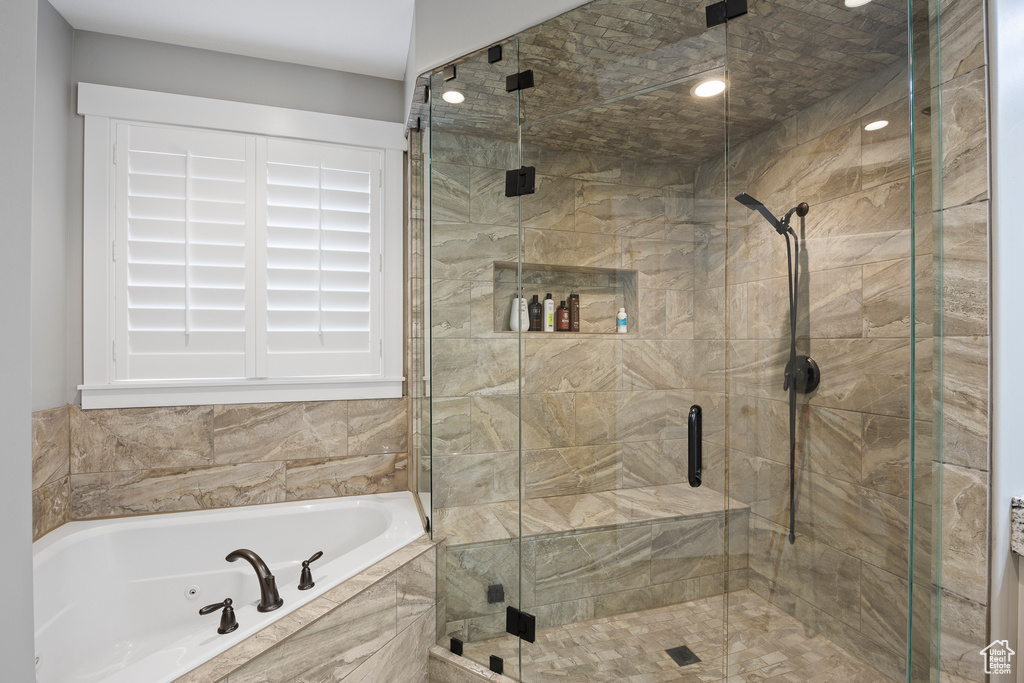 Full bathroom with a bath, a stall shower, and recessed lighting