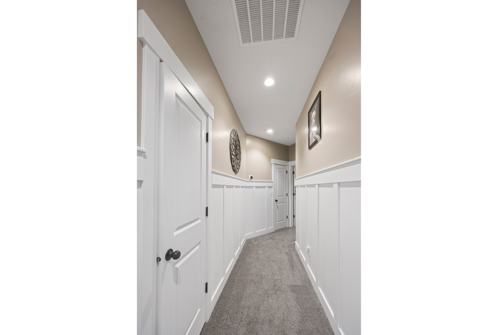 Hallway featuring carpet flooring and recessed lighting