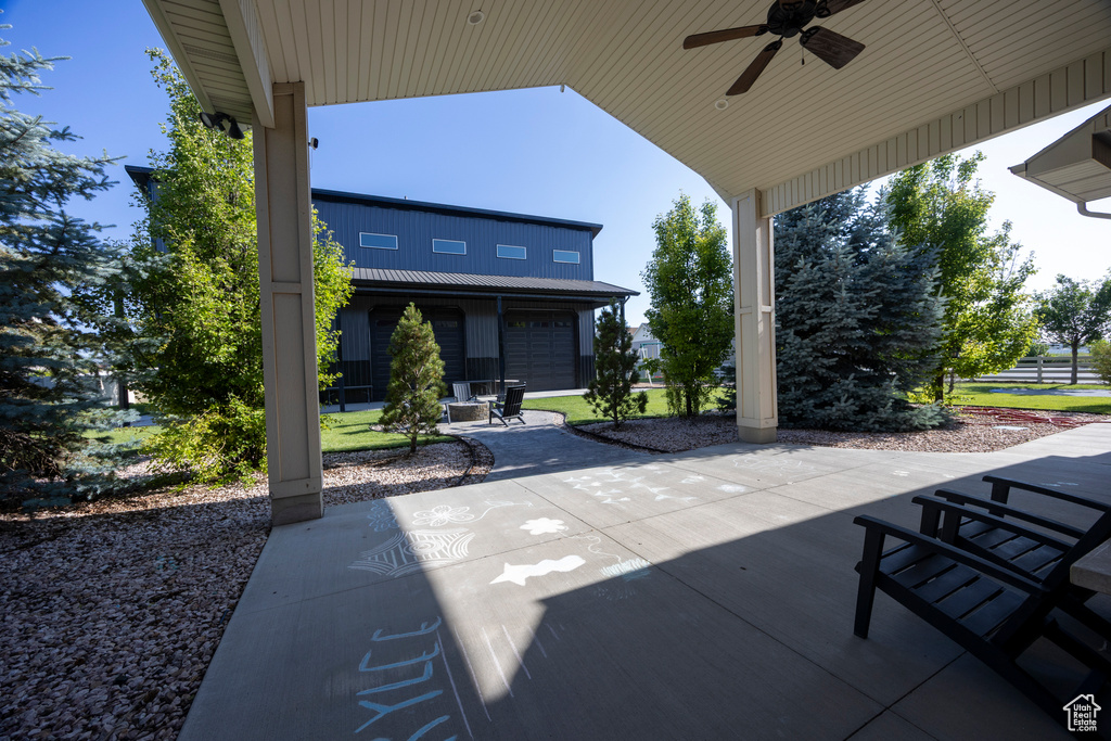 View of patio featuring a ceiling fan