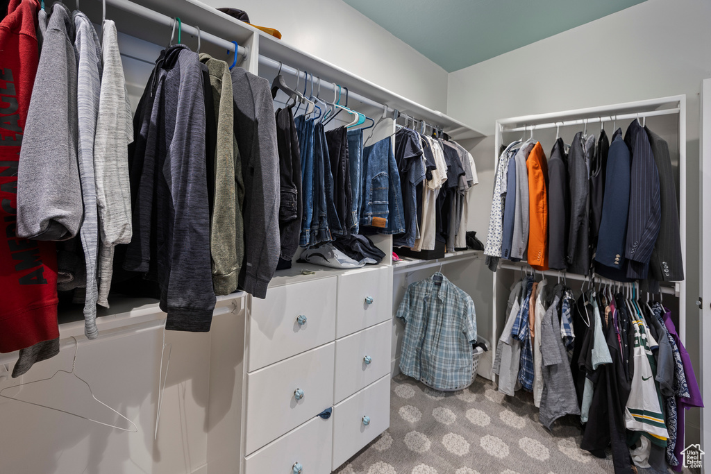 Walk in closet featuring carpet flooring
