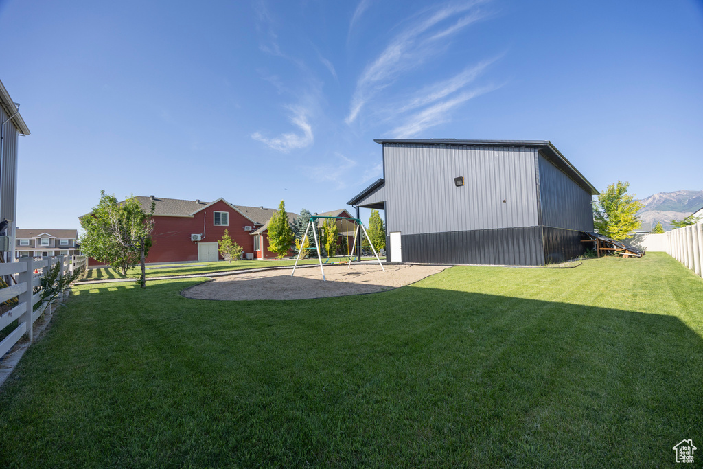 View of yard featuring a playground