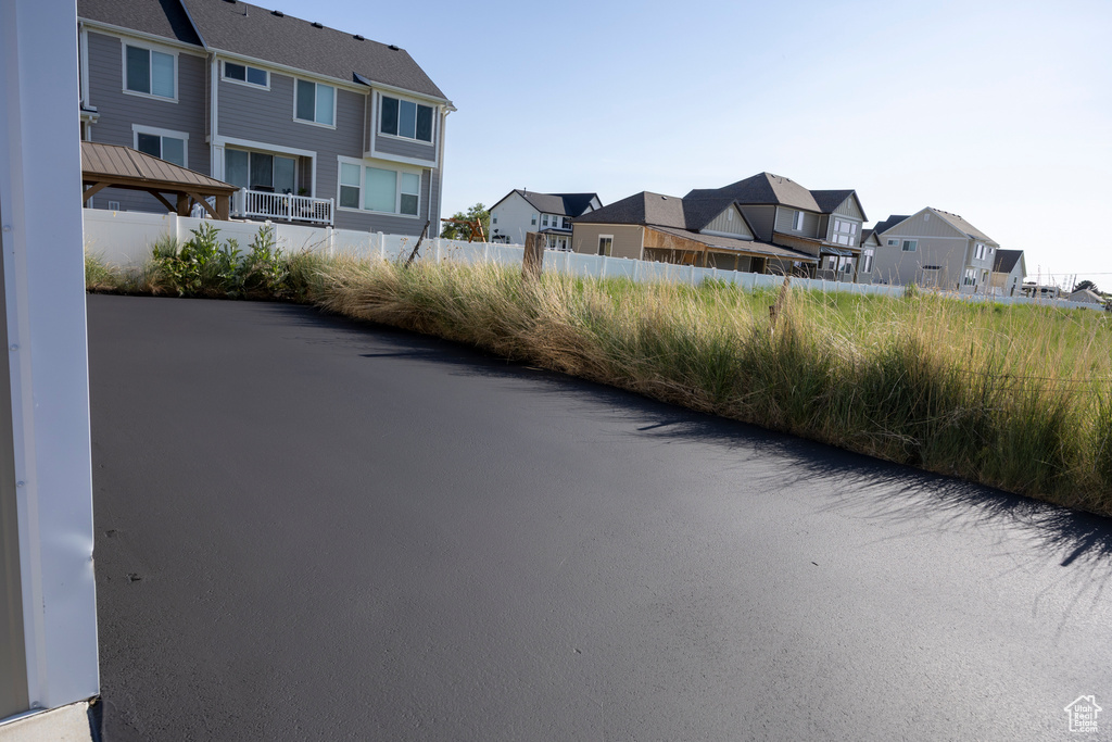 View of asphalt street with a residential view