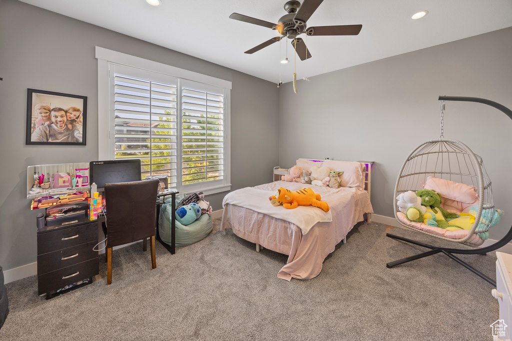 Carpeted bedroom featuring baseboards, recessed lighting, and ceiling fan