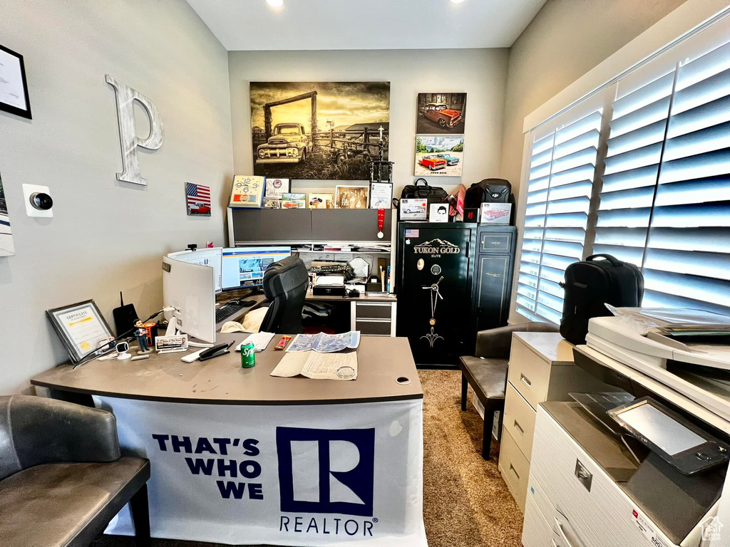 Carpeted home office with recessed lighting