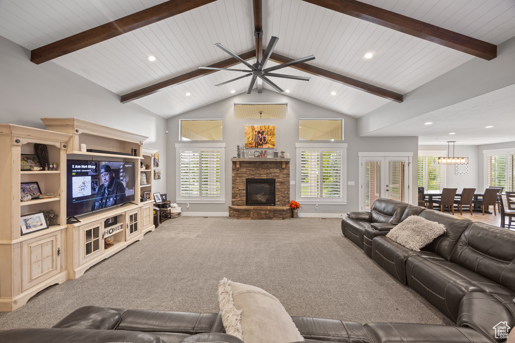 Living room featuring a fireplace, recessed lighting, ceiling fan, baseboards, and carpet flooring