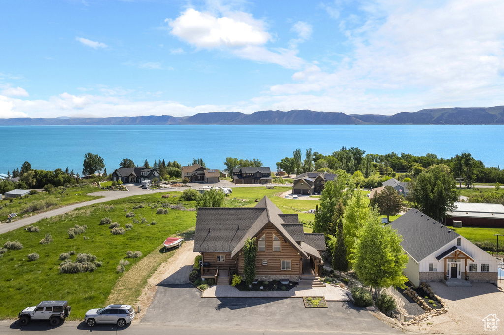 View of subject property featuring a water and mountain view