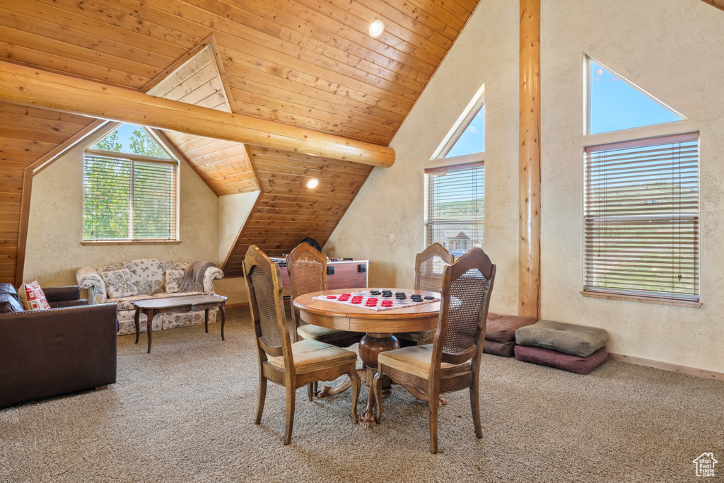 Dining area featuring carpet flooring and wood ceiling