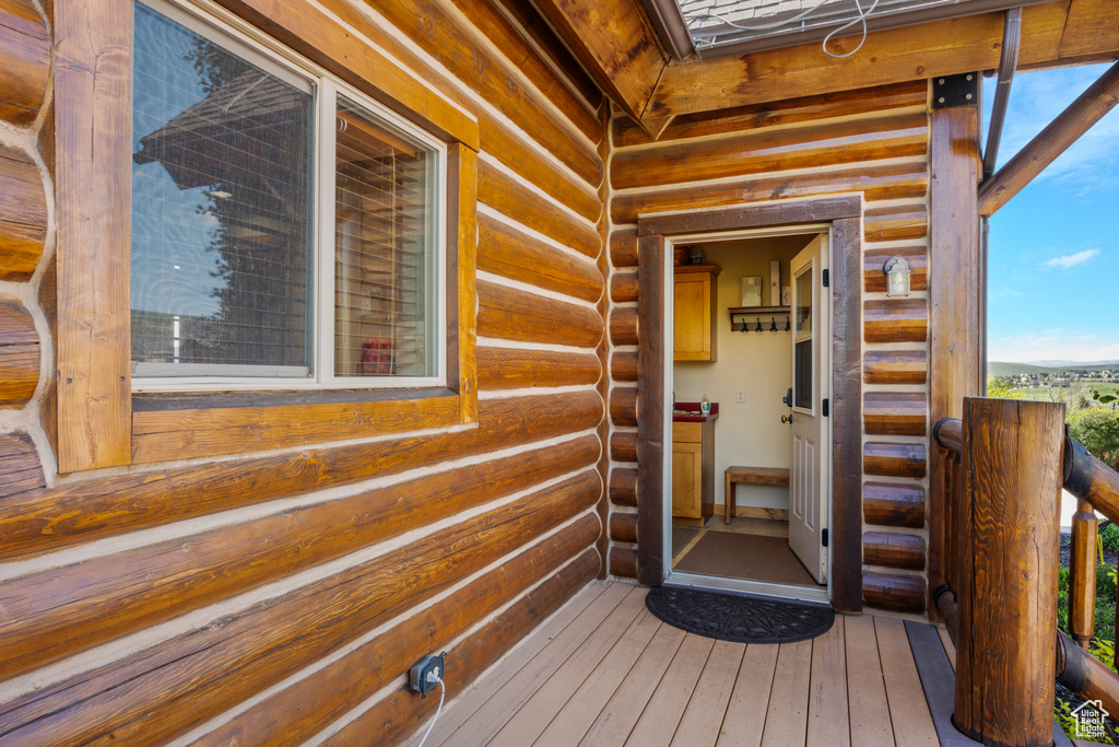 Property entrance featuring log siding