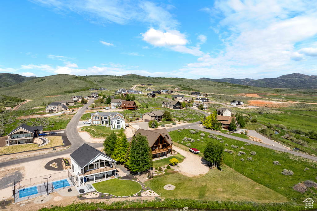 Aerial view of residential area featuring a mountainous background