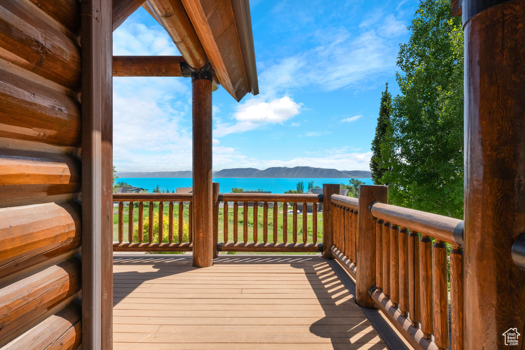 Wooden deck with a water and mountain view