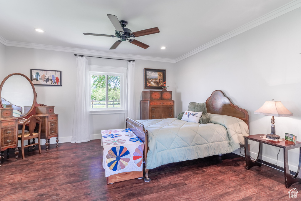 Bedroom with wood finished floors, crown molding, baseboards, recessed lighting, and ceiling fan
