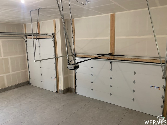 Garage featuring baseboards