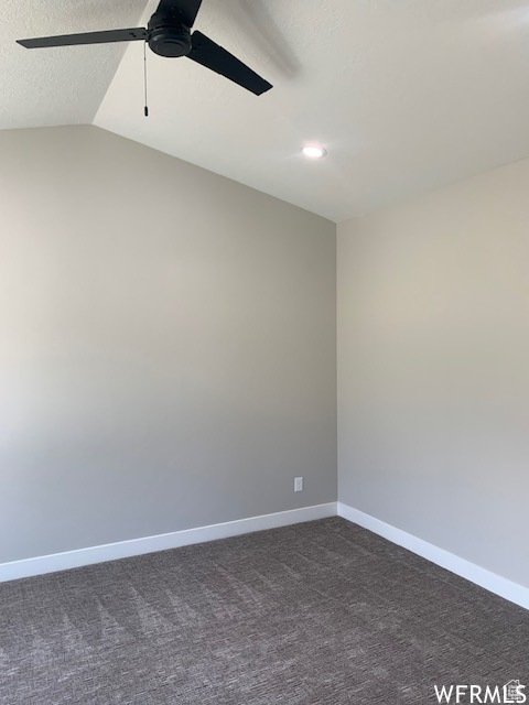 Unfurnished room with ceiling fan, dark colored carpet, baseboards, recessed lighting, and vaulted ceiling