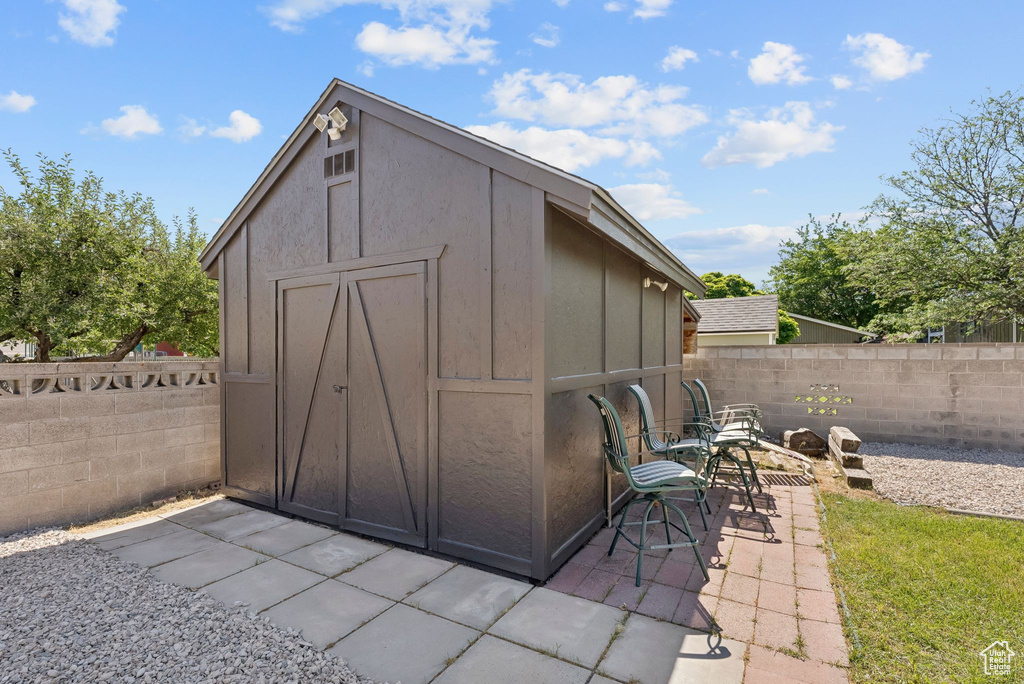 View of shed featuring a fenced backyard