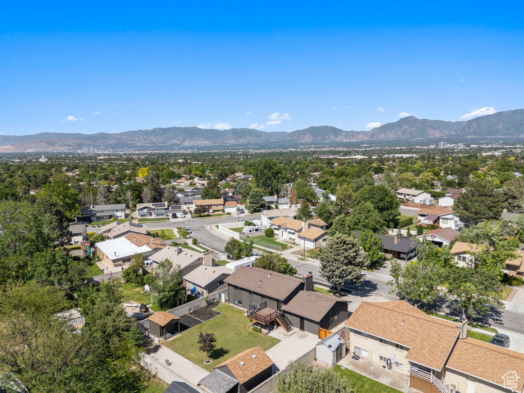 Aerial perspective of suburban area featuring a mountain backdrop