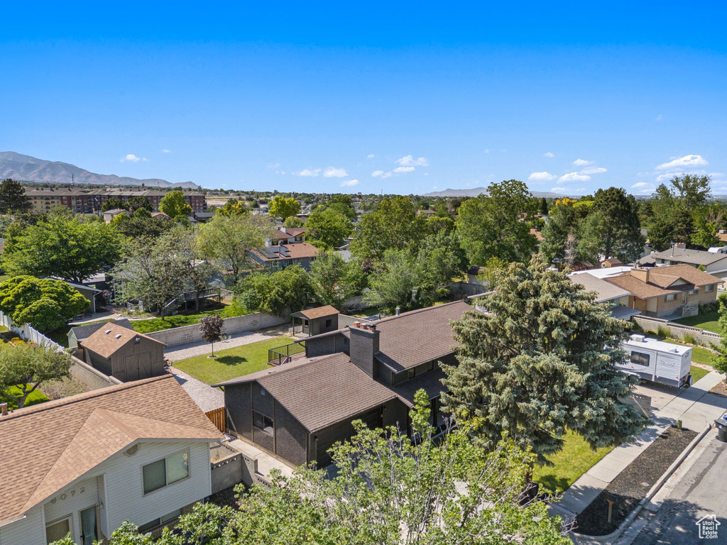 Aerial perspective of suburban area featuring a mountain backdrop