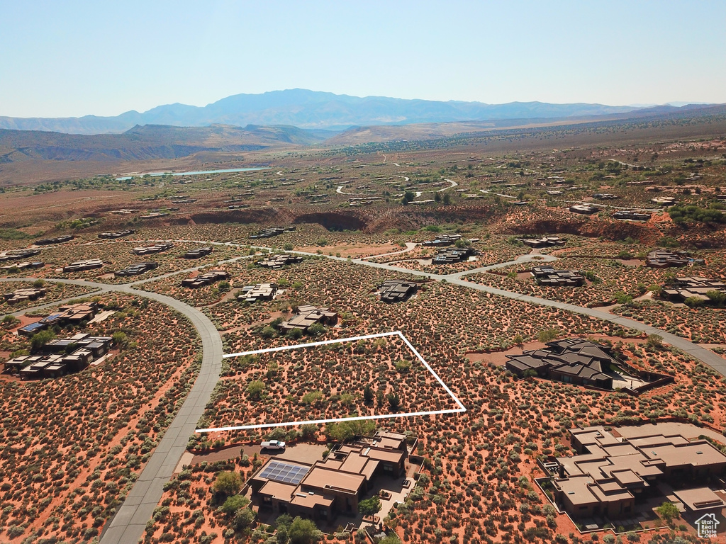 Aerial view of property's location featuring mountains and property parcel outlined