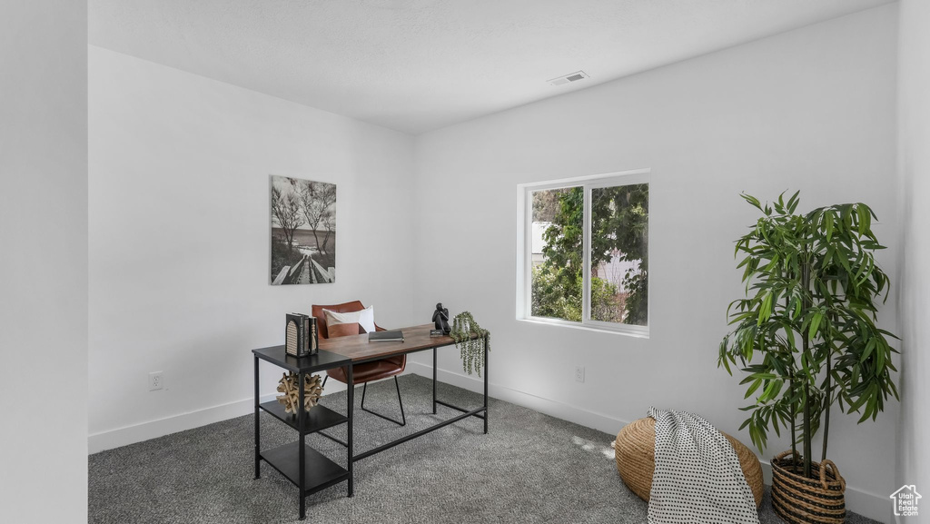 Office featuring baseboards and carpet floors