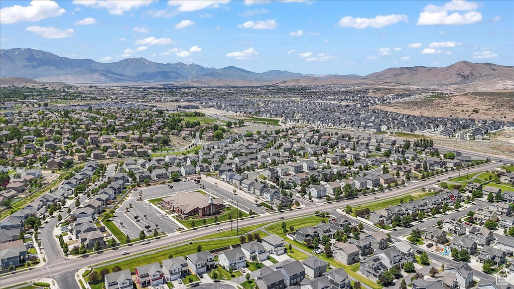 Aerial perspective of suburban area featuring a mountain backdrop