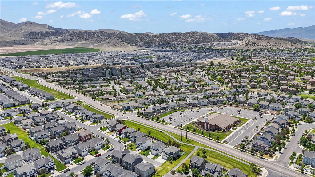Aerial view of residential area with a mountainous background