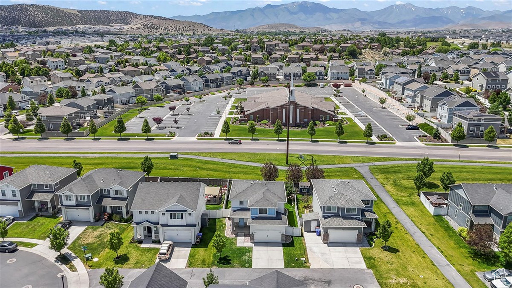 Aerial view of residential area featuring mountains