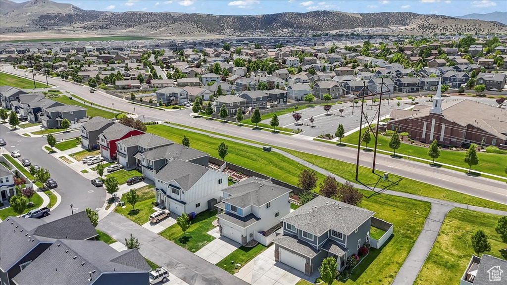 Aerial view of residential area featuring a mountain backdrop
