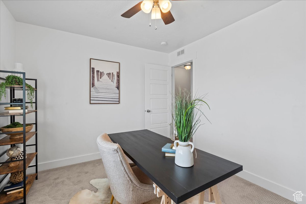 Office featuring baseboards, a ceiling fan, and carpet