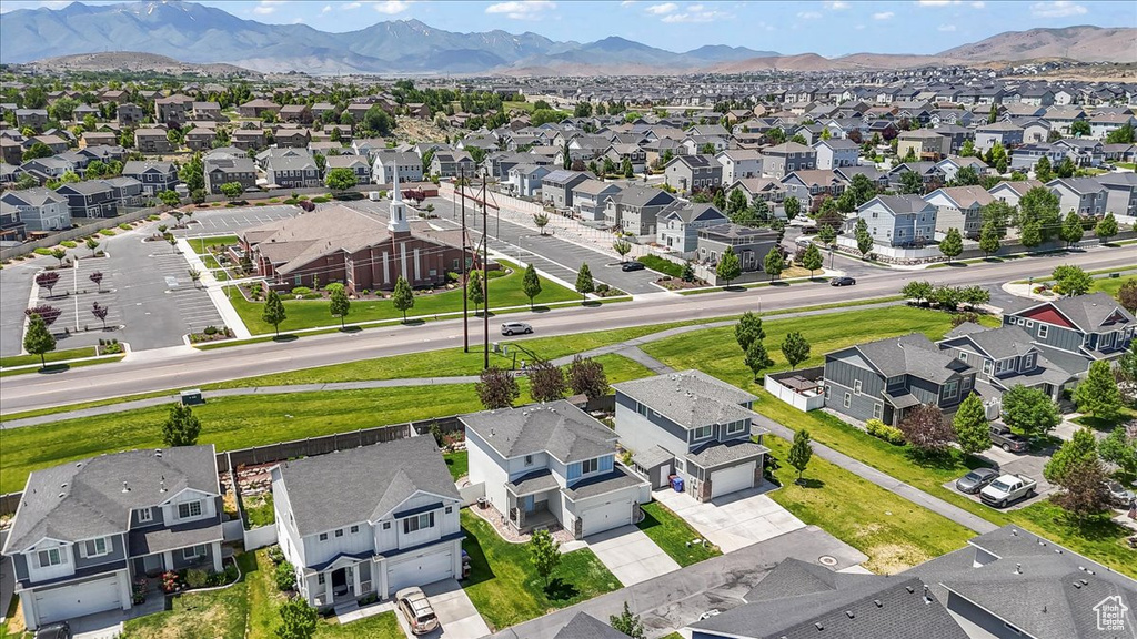 Aerial view of residential area featuring a mountain backdrop