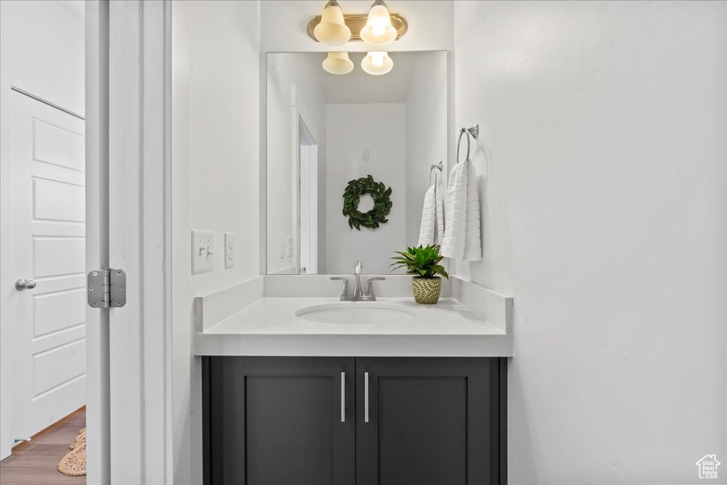 Bathroom with vanity and wood finished floors