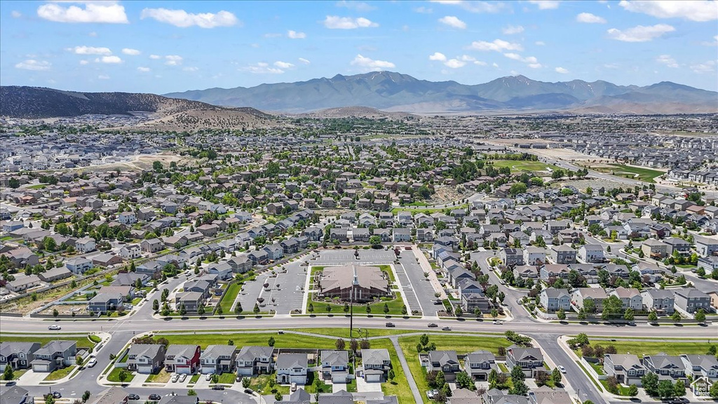 Aerial view of residential area with a mountainous background