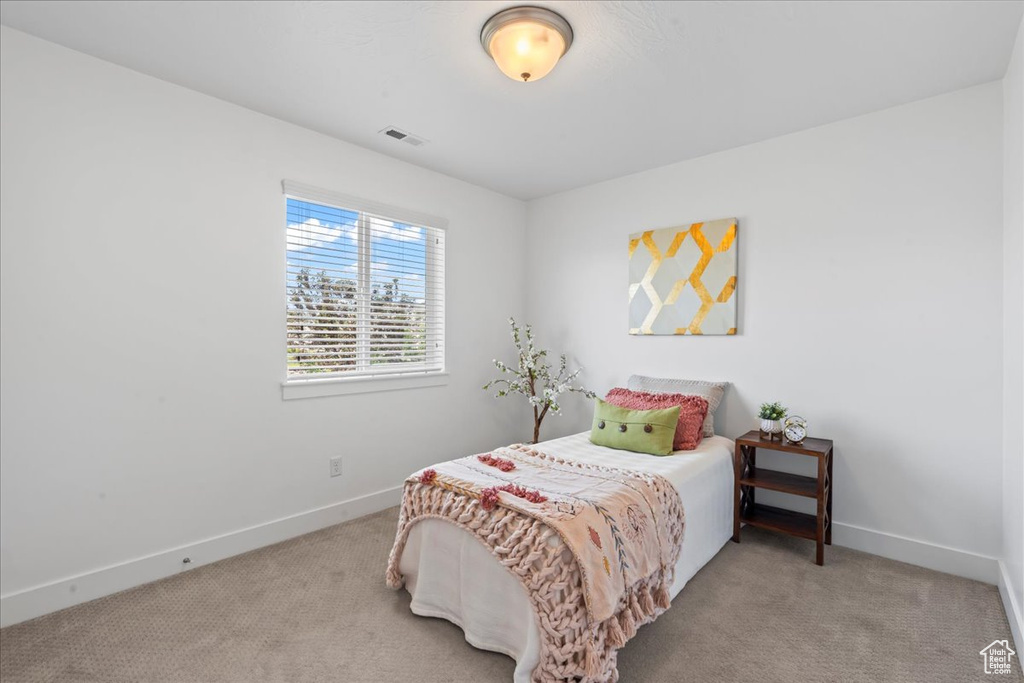 Bedroom with carpet and baseboards