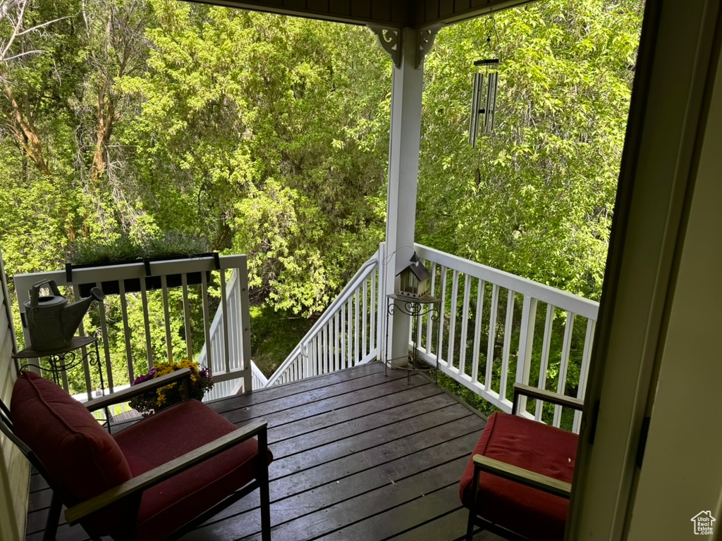 Wooden deck with a wooded view