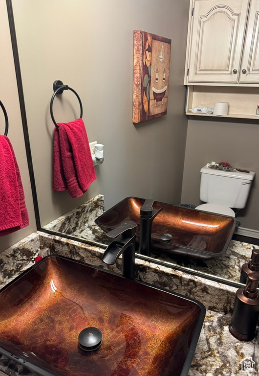 Half bathroom featuring toilet