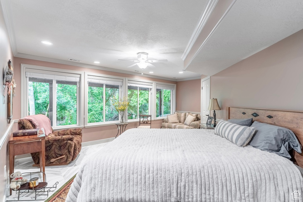 Bedroom with crown molding, recessed lighting, and a ceiling fan