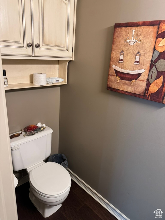 Bathroom featuring baseboards and wood finished floors